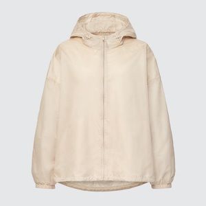 Uniqlo x Theory lightweight nylon parka in the color natural. Sold out online.